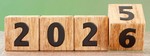 Wooden blocks turning from 2025 to 2026