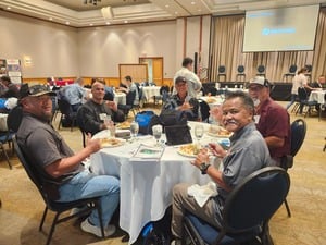 Superintendents Conference attendees seated at round tables during a session