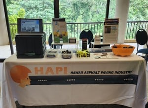 HAPI exhibitor table at the Superintendents Conference with brochures, giveaways and a display screen