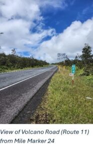 Route 11 on Hawaiʻi Island near milepost 24, a two-lane highway under a cloudy sky