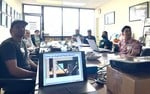 Attendees around a conference table at the HAPI office for the Job Mix Formula Submittal workshop